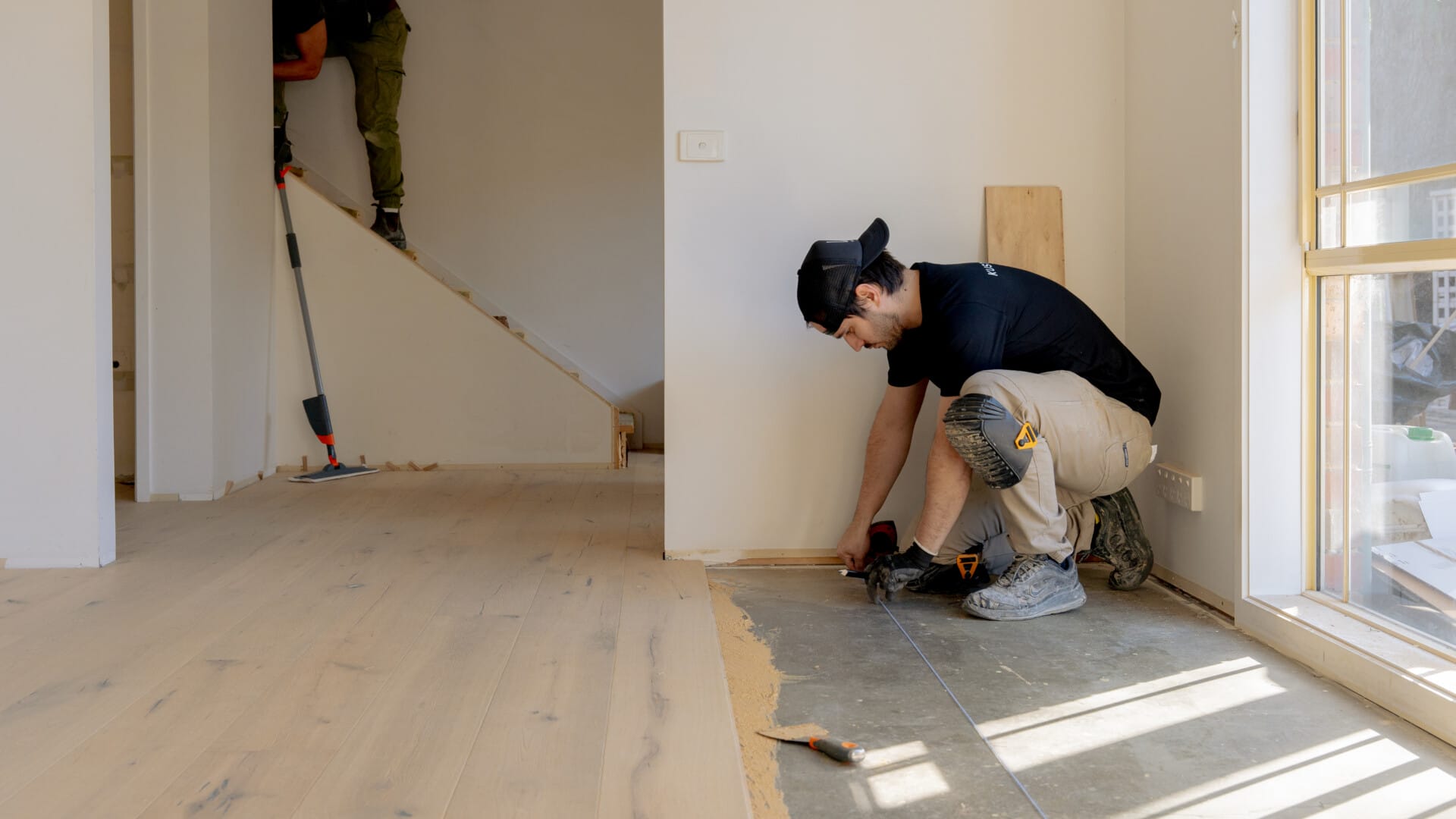 Engineered timber flooring being installed by Kustom Timber installer