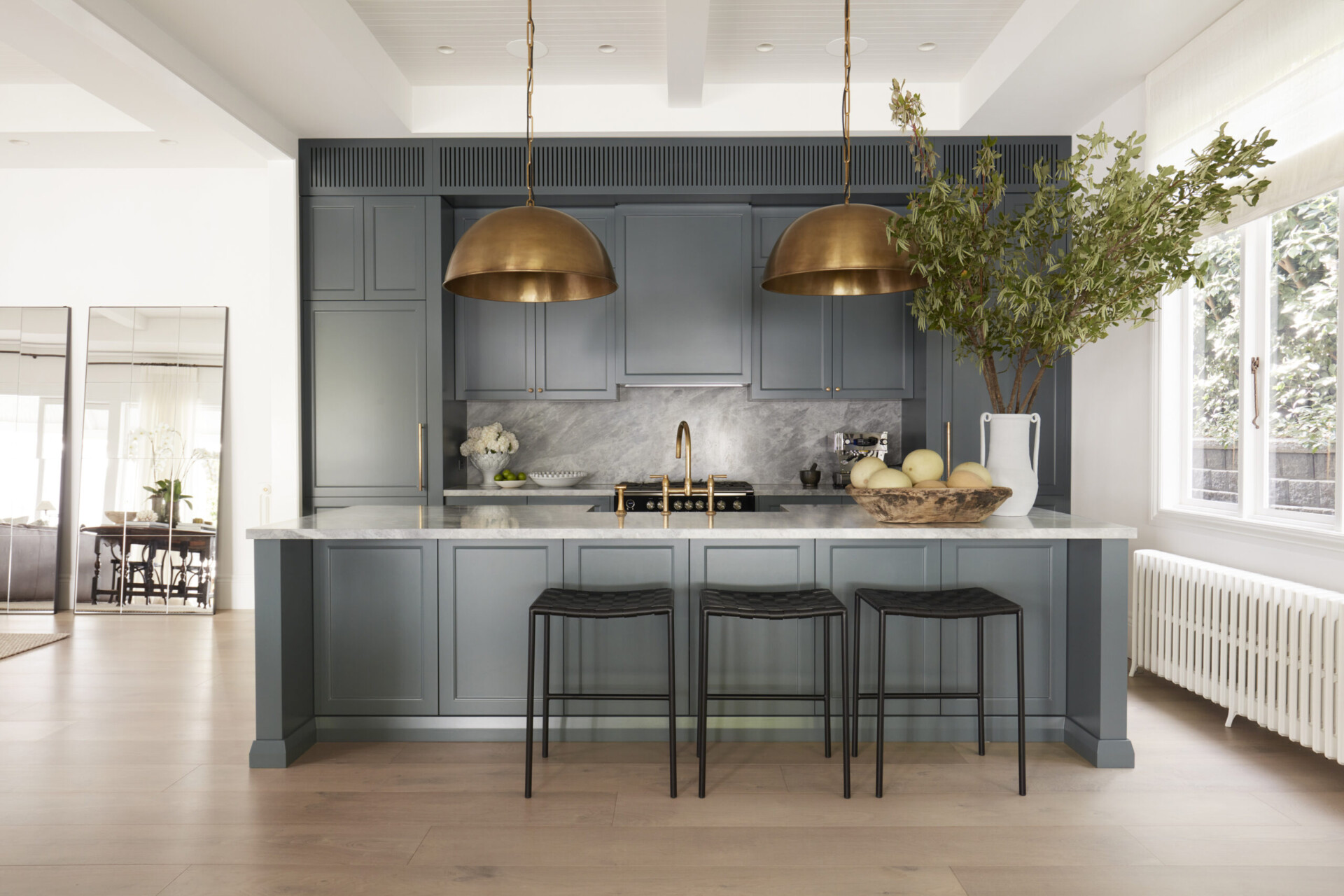 dark kitchen cabinets with light timber flooring