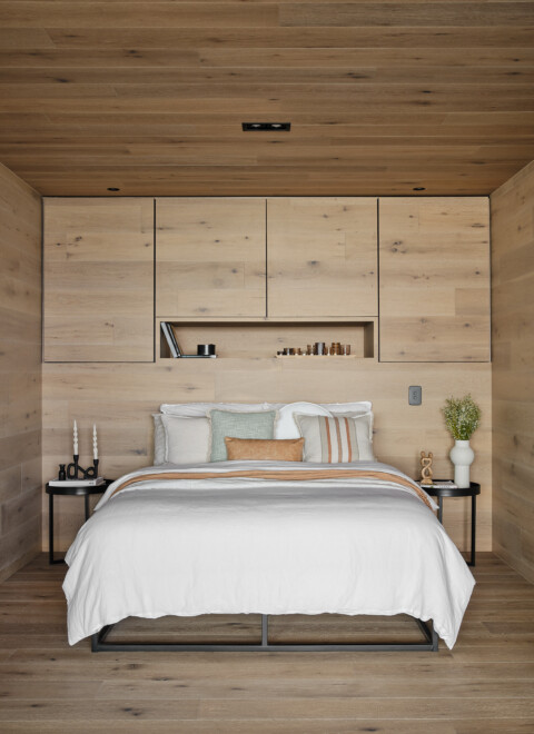 Engineered timber flooring in Kustom Timber’s Fume finish with plank pattern, featured in a custom timber-clad bedroom at Mount Martha Retreat.