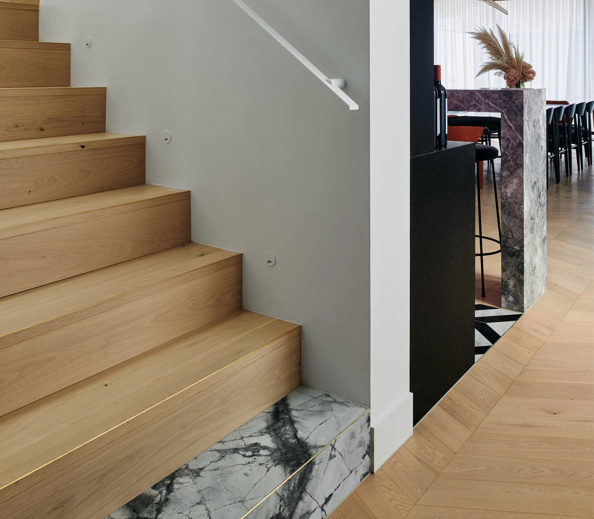 Square mitre timber stairs with brass insert