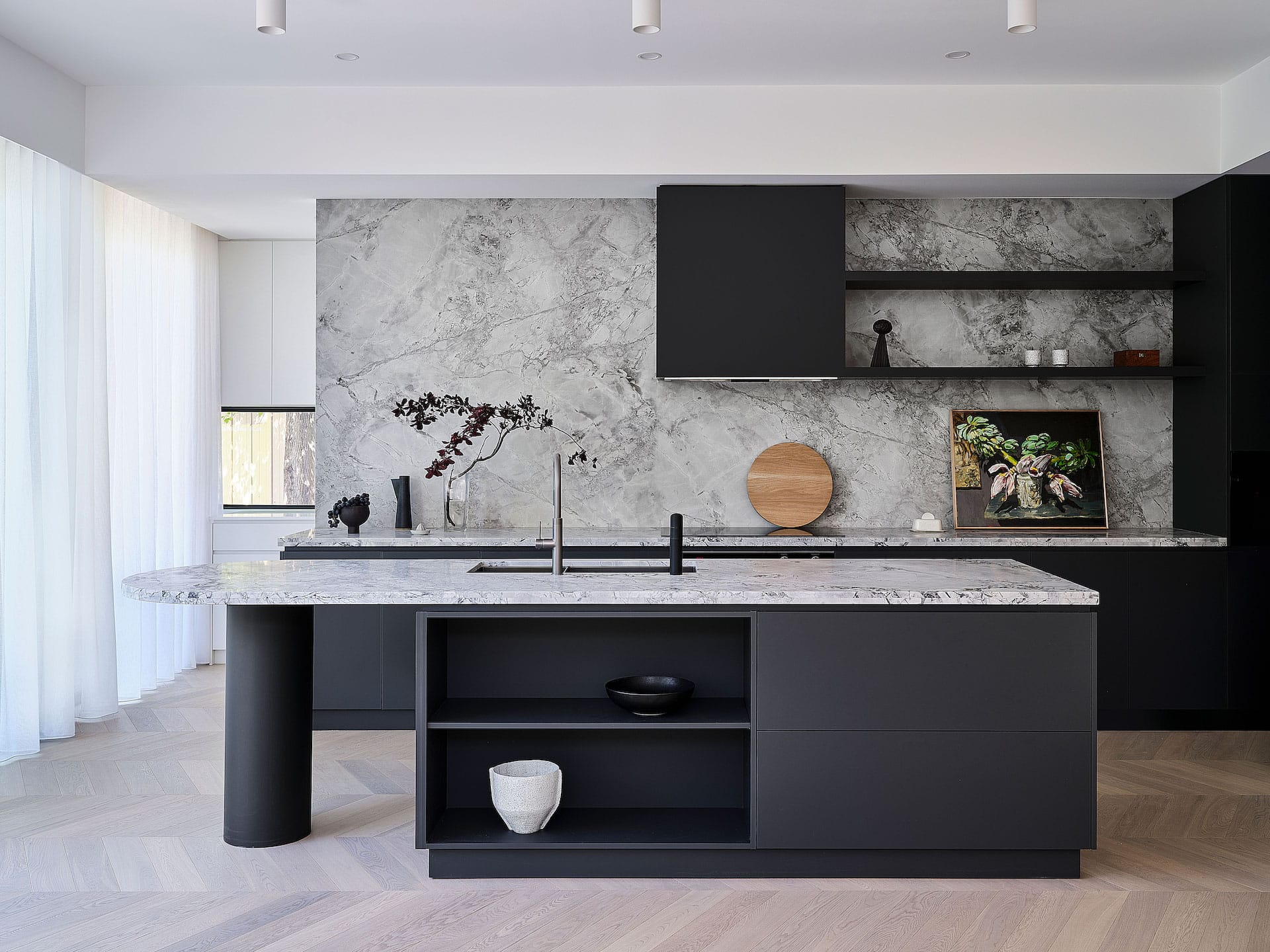 Modern Japandi kitchen with matte black island cabinetry