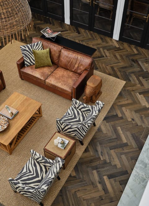 Dark timber herringbone parquetry in the Le Cru finish by Kustom Timber, featured throughout a Mount Martha home interior.