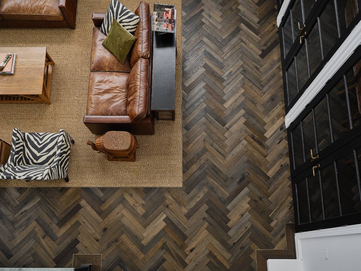 Herringbone parquetry flooring in Kustom Timber’s Le Cru finish, viewed from above in a Mount Martha residence living area.