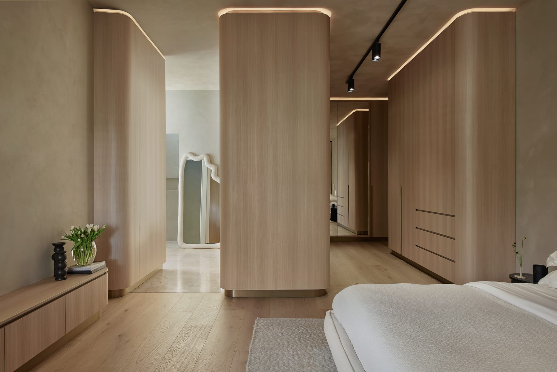 Light timber flooring paired with cladding and built in cabinetry subtle lighting and 