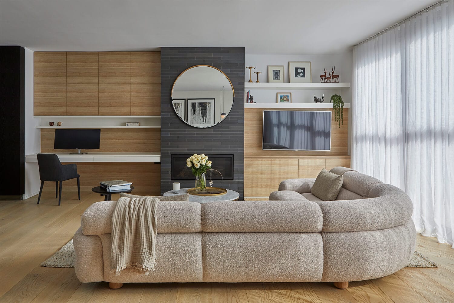 Bedroom interior with floor-to-ceiling timber wall panelling and engineered timber flooring in pale European oak.