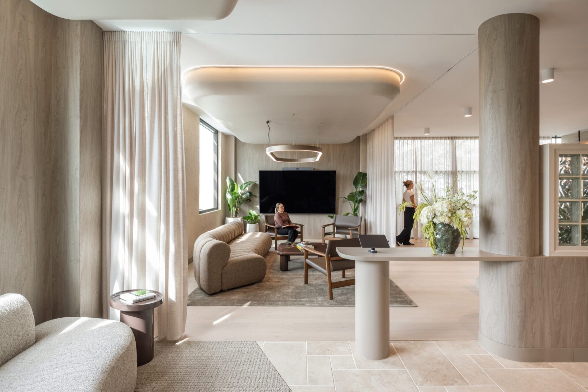 Business lounge at the McCormack and Studio 103 Brisbane office, with curved ceiling, ring pendant and Alta timber flooring