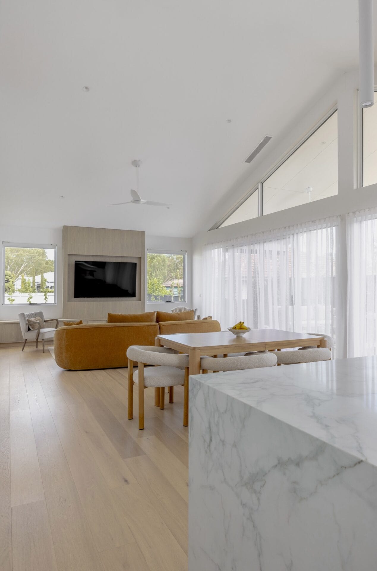 Double-height void with a raked ceiling and high-level glazing