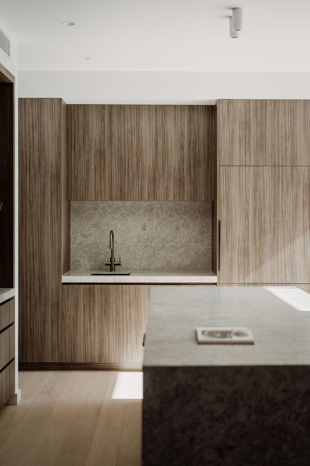 Close view of warm timber joinery with a vertical grain