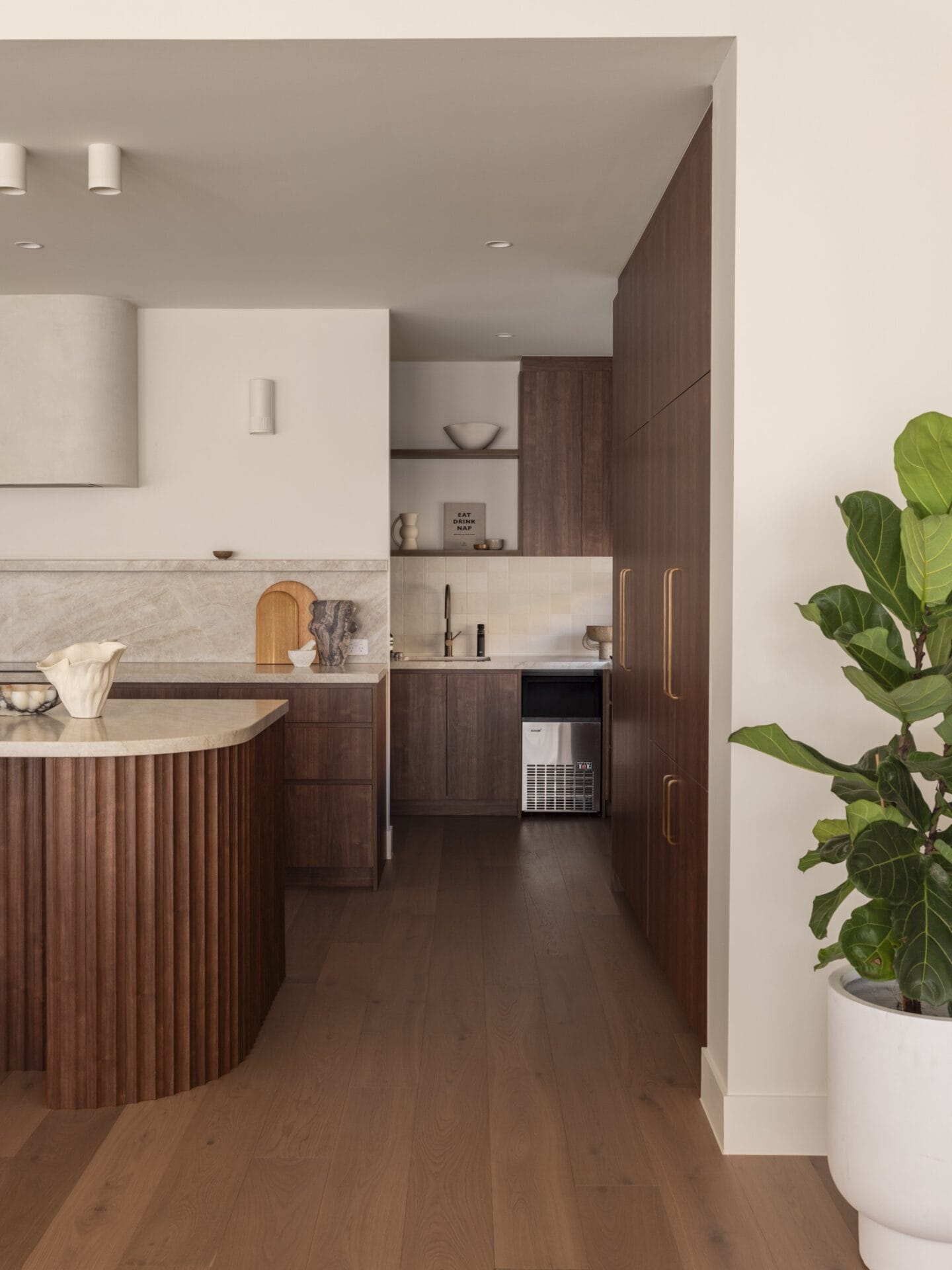 Full-height walnut kitchen joinery with Dakar oak flooring at MARÈA